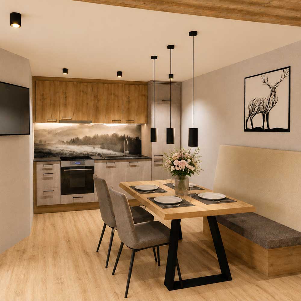Moderne Küche im Chalet Laudegg in Ladis mit Holzschränken, Esstisch und Pendelleuchten.